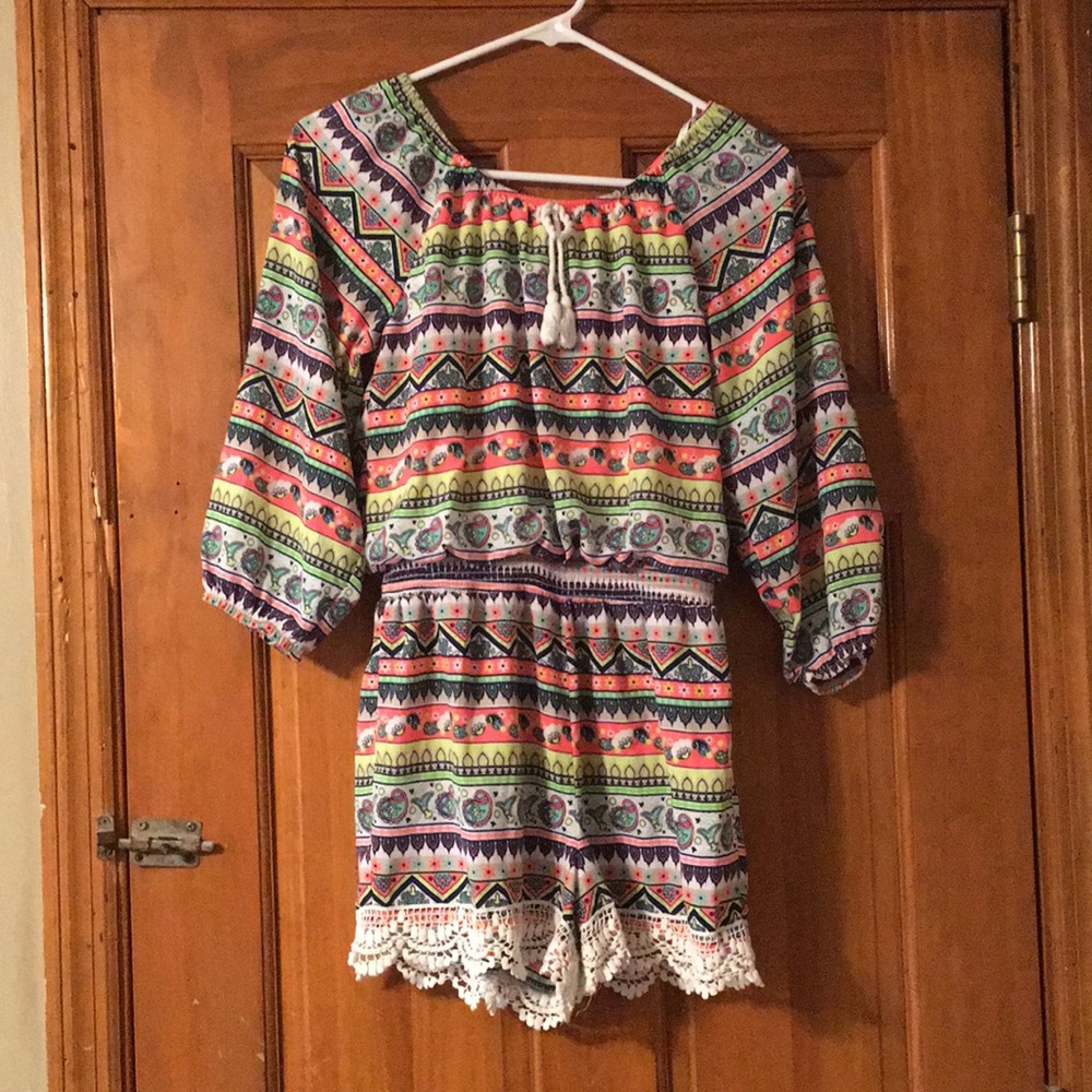 A colorful jump suit but with shorts for juniors.